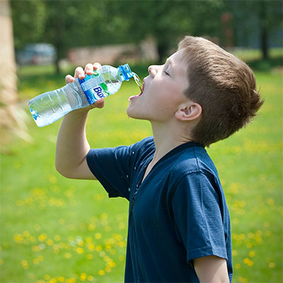 Boy taking a drink of water