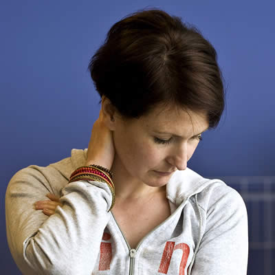 A young adult woman looking stressed