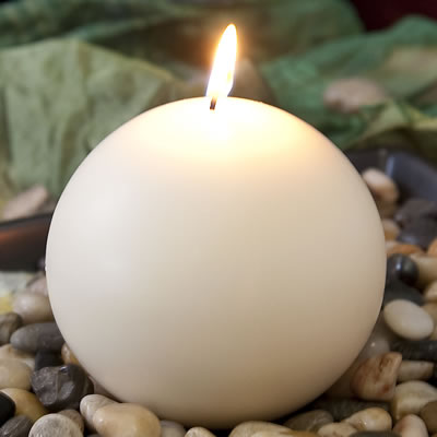 Spiritual needs - close up of a candle in chapel room 