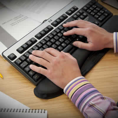 Man using a keyboard at desk