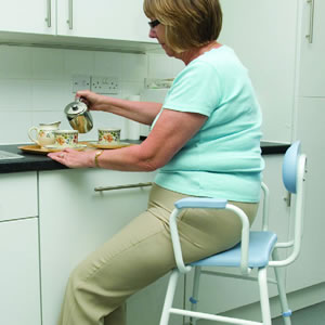 Preparing meals sitting on a stool