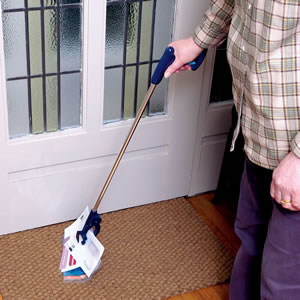 Easy reacher, shown being used to pick up mail